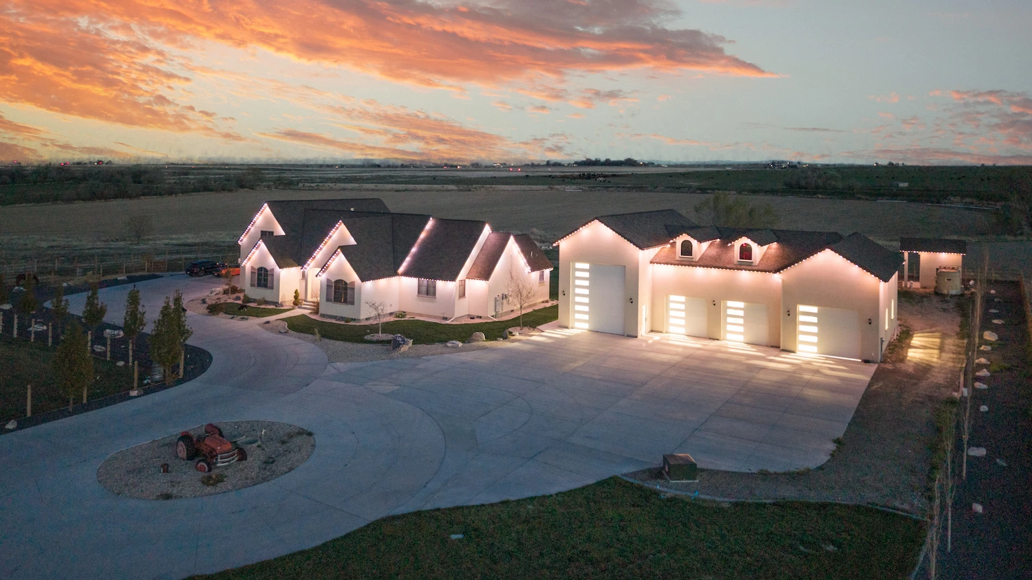 Warm white tracing every gable at twilight